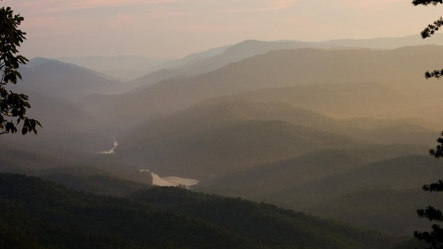 Scenic view of forested mountains